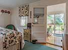 The bedroom flows onto a private climate controlled porch