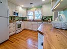 As you step into the kitchen you will see the beautiful Chinese Elm on the sideboard